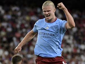 Manchester City's Norwegian striker Erling Haaland celebrates after scoring his team's third goal during the UEFA Champions League Group G first-leg football match between Sevilla FC and Manchester City, at the Ramon Sanchez Pizjuan stadium in Seville on September 6, 2022. (Photo by CRISTINA QUICLER / AFP)