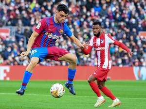 Barcelona's Spanish midfielder Pedri controls the ball during the Spanish league football match between FC Barcelona and Club Atletico de Madrid at the Camp Nou stadium in Barcelona on February 6, 2022. (Photo by LLUIS GENE / AFP)