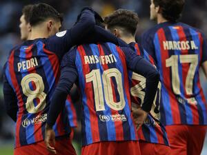 Barcelona's Spanish forward Ansu Fati is congratulated by teammates for scoring their second goal during the Spanish Super Cup semi-final football match between Real Betis and FC Barcelona at the King Fahd International Stadium in Riyadh, Saudi Arabia, on January 12, 2023. (Photo by Giuseppe CACACE / AFP)