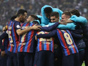 Barcelona's Spanish midfielder Pedri celebrates with teammates after scoring his team's third goal during the Spanish Super Cup final football match between Real Madrid CF and FC Barcelona at the King Fahd International Stadium in Riyadh, Saudi Arabia, on January 15, 2023. (Photo by Giuseppe CACACE / AFP)