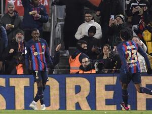 Barcelona's French forward Ousmane Dembele (L) celebrates scoring his team's first goal during the Copa del Rey (King's Cup), quarter final football match between FC Barcelona and Real Sociedad, at the Camp Nou stadium in Barcelona on January 25, 2023. (Photo by Josep LAGO / AFP)