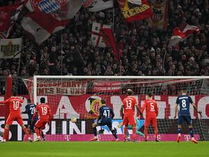 Cologne's Tunisian midfielder Ellyes Skhiri (2ndL) scores the opening goal during the German first division Bundesliga football match between Bayern Munich and FC Cologne in Munich, southern Germany, on January 24, 2023. (Photo by CHRISTOF STACHE / AFP) 