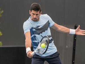 Serbian tennis player Novak Djokovic hits a return during a practice session ahead of the ATP Adelaide International tournament, in Adelaide on December 30, 2022. (Photo by Brenton EDWARDS / AFP)