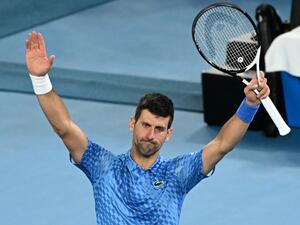Serbia's Novak Djokovic celebrates after victory against Australia's Alex De Minaur during their men's singles match on day eight of the Australian Open tennis tournament in Melbourne on January 23, 2023. (Photo by WILLIAM WEST / AFP)