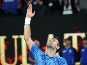 Serbia's Novak Djokovic celebrates victory in the men's singles final match against Greece's Stefanos Tsitsipas on day fourteen of the Australian Open tennis tournament in Melbourne on January 29, 2023. (Photo by DAVID GRAY / AFP)