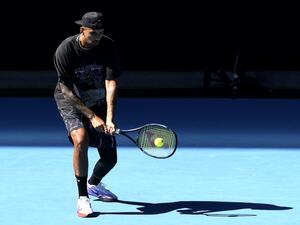 Australia's Nick Kyrgios hits a return during a practice session ahead of the Australian Open tennis tournament in Melbourne on January 14, 2023. (Photo by Paul CROCK / AFP)