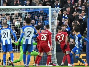 Brighton's Japanese midfielder Kaoru Mitoma (R) scores their second goal during the English FA Cup fourth round football match between Brighton & Hove Albion and Liverpool at the Amex stadium in Brighton, on the south coast of England on January 29, 2023. (Photo by Glyn KIRK / AFP) 