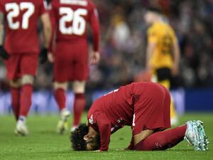 Liverpool's Egyptian striker Mohamed Salah prays after scoring his team's second goal during the English FA Cup third round football match between Liverpool and Wolverhampton Wanderers at Anfield in Liverpool, north-west England on January 7, 2023. (Photo by Oli SCARFF / AFP)