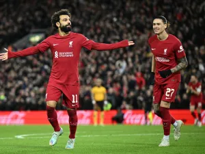 Liverpool's Egyptian striker Mohamed Salah (L) celebrates scoring his team's second goal during the English FA Cup third round football match between Liverpool and Wolverhampton Wanderers at Anfield in Liverpool, north-west England on January 7, 2023. (Photo by Oli SCARFF / AFP)