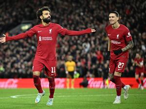 Liverpool's Egyptian striker Mohamed Salah (L) celebrates scoring his team's second goal during the English FA Cup third round football match between Liverpool and Wolverhampton Wanderers at Anfield in Liverpool, north-west England on January 7, 2023. (Photo by Oli SCARFF / AFP)