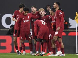 Liverpool's English midfielder Harvey Elliott (rear C) celebrates after scoring his team first goal during the FA Cup third round football match between Wolverhampton Wanderers and Liverpool FC at the Molineux stadium in Wolverhampton, central England on January 17, 2023. (Photo by Oli SCARFF / AFP)