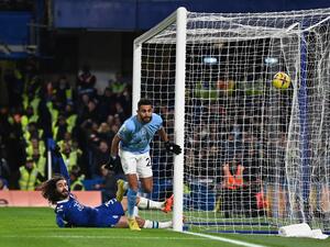 Manchester City's Algerian midfielder Riyad Mahrez celebrates scoring the opening goal during the English Premier League football match between Chelsea and Manchester City at Stamford Bridge in London on January 5, 2023. (Photo by Glyn KIRK / IKIMAGES / AFP)