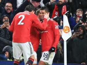 Manchester United's Brazilian midfielder Casemiro (R) celebrates scoring the opening goal with Manchester United's Swedish defender Victor Lindelof (L) during the English Premier League football match between Manchester United and Bournemouth at Old Trafford in Manchester, north west England, on January 3, 2023. (Photo by Lindsey Parnaby / AFP) 