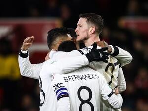 Manchester United's Dutch striker Wout Weghorst (C) celebrates with teammates after scoring his team second goal during the English League Cup semi-final first-leg football match between Nottingham Forest and Manchester United, at The City Ground stadium, in Nottingham, central England, on January 25, 2023. (Photo by Darren Staples / AFP)