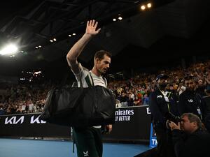 Britain's Andy Murray waves as he leaves after losing to Spain's Roberto Bautista Agut during their men's singles match on day six of the Australian Open tennis tournament in Melbourne on January 21, 2023. (Photo by WILLIAM WEST / AFP)