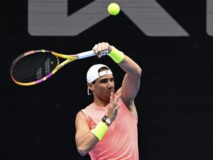 Spain's Rafael Nadal hits a return during a practice session at the Malbourne Park ahead of the Australian Open tennis tournament in Melbourne on January 15, 2023. (Photo by MANAN VATSYAYANA / AFP)
