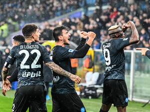 Napoli's Macedonian midfielder Eljif Elmas (C) celebrates with Napoli's Italian defender Giovanni Di Lorenzo (L) and Napoli's Nigerian forward Victor Osimhen after scoring a penalty during the Italian Serie A football match between Sampdoria and Napoli on January 8, 2023 at the Luigi-Ferraris stadium in Genoa. (Photo by Andreas SOLARO / AFP)
