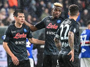 Napoli's Mexican forward Hirving Lozano (L) and Napoli's Nigerian forward Victor Osimhen react at the end of the Italian Serie A football match between Sampdoria and Napoli on January 8, 2023 at the Luigi-Ferraris stadium in Genoa. (Photo by Andreas SOLARO / AFP)