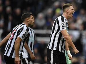 Newcastle United's Swiss defender Fabian Schar (L) and Newcastle United's Dutch defender Sven Botman react after a Fulham penalty was disallowed during the English Premier League football match between Newcastle United and Fulham at St James' Park in Newcastle-upon-Tyne, north-east England on January 15, 2023. (Photo by Oli SCARFF / AFP) 
