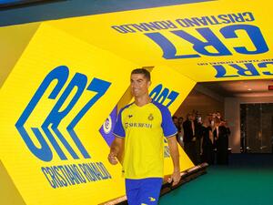Al-Nassr's new Portuguese forward Cristiano Ronaldo entering the pitch during his unveiling ceremony at the Mrsool Park Stadium in the Saudi capital Riyadh on January 3, 2023. (Photo by Jorge Ferrari / Al Nassr Football Club / AFP)