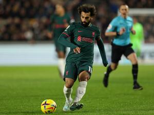 Liverpool's Egyptian striker Mohamed Salah plays a pass during the English Premier League football match between Brentford and Liverpool at Gtech Community Stadium in London on January 2, 2023. (Photo by Adrian DENNIS / AFP) 