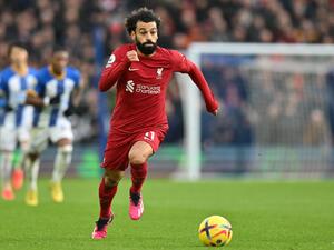 Liverpool's Egyptian striker Mohamed Salah runs with the ball during the English Premier League football match between Brighton and Hove Albion and Liverpool at the American Express Community Stadium in Brighton, southern England on January 14, 2023. (Photo by Glyn KIRK / AFP)