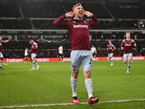 West Ham United's English striker Jarrod Bowen (C) celebrates scoring the opening goal during the English FA Cup fourth round football match between Derby County and West Ham United at Pride Park Stadium in Derby, central England on January 31, 2023. (Photo by Paul ELLIS / AFP) 