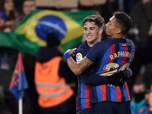 Barcelona's Brazilian forward Raphinha (R) celebrates with Barcelona's Spanish midfielder Gavi after scoring his team's third goal during the Spanish league football match between FC Barcelona and Sevilla FC at the Camp Nou stadium in Barcelona, on February 5, 2023. (Photo by Josep LAGO / AFP)