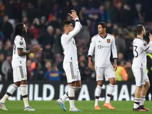 Manchester United's players react at the end of the UEFA Europa League round of 32 first-leg football match between FC Barcelona and Manchester United at the Camp Nou stadium in Barcelona, on February 16, 2023. (Photo by Josep LAGO / AFP)