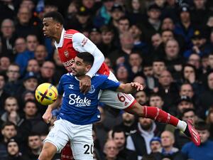 Arsenal's Brazilian defender Gabriel Magalhaes (back) heads the ball with Everton's French striker Neal Maupay during the English Premier League football match between Everton and Arsenal at Goodison Park in Liverpool, north-west England, on February 4, 2023. (Photo by Paul ELLIS / AFP) 