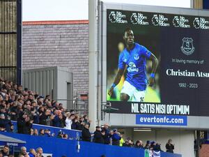 Supporters observe a minute's applause for former Everton player Christian Atsu, who died in the Turkey earthquake last week, ahead of the English Premier League football match between Everton and Leeds United at Goodison Park in Liverpool, north west England on February 18, 2023. (Photo by Lindsey Parnaby / AFP) 