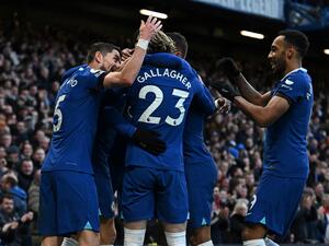 Chelsea's German midfielder Kai Havertz celebrates with teammates after scoring the opening goal during the English Premier League football match between Chelsea and Crystal Palace at Stamford Bridge in London on January 15, 2023. (Photo by Ben Stansall / AFP)