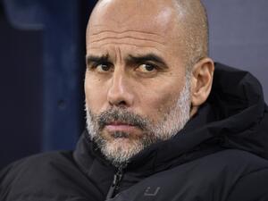 Manchester City's Spanish manager Pep Guardiola attends the English FA Cup fourth round football match between Manchester City and Arsenal at the Etihad Stadium in Manchester, northwest England, on January 27, 2023. (Photo by Oli SCARFF / AFP)