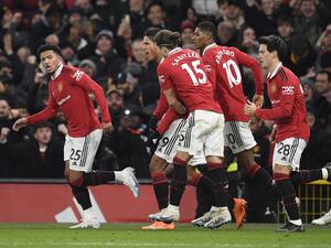 Manchester United's English striker Jadon Sancho (L) celebrates after scoring his team second goal during the English Premier League football match between Manchester United and Leeds United at Old Trafford in Manchester, north west England, on February 8, 2023. (Photo by Oli SCARFF / AFP)
