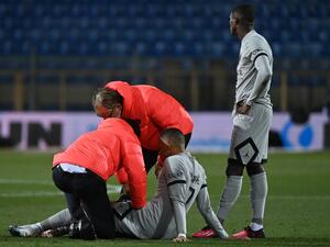 Paris Saint-Germain's French forward Kylian Mbappe receives medical assistance after getting injured during the French L1 football match between Montpellier Herault SC and Paris Saint-Germain (PSG) at Stade de la Mosson in Montpellier, southern France on February 1, 2023. (Photo by Sylvain THOMAS / AFP)