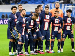 Paris Saint Germain's players pose for a team photograph prior to the French Cup round of 16 football match between Olympique Marseille (OM) and Paris Saint-Germain (PSG) at Stade Velodrome in Marseille, southern France on February 8, 2023. (Photo by Nicolas TUCAT / AFP)