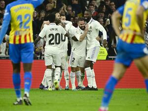 Real Madrid players celebrate their first goal scored by Real Madrid's Spanish midfielder Marco Asensio during the Spanish league football match between Real Madrid CF and Valencia CF at the Santiago Bernabeu stadium in Madrid on February 2, 2023. (Photo by JAVIER SORIANO / AFP)