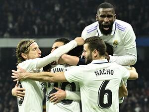 Real Madrid players celebrate their second goal scored by Real Madrid's Brazilian forward Vinicius Junior during the Spanish league football match between Real Madrid CF and Valencia CF at the Santiago Bernabeu stadium in Madrid on February 2, 2023. (Photo by JAVIER SORIANO / AFP)