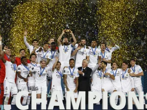 Real Madrid's players celebrate with the trophy at the end of the FIFA Club World Cup final football match between Spain's Real Madrid and Saudi Arabia's Al-Hilal at the Prince Moulay Abdellah Stadium in Rabat on February 11, 2023. Real Madrid lifted the Club World Cup for a record fifth time with a pulsating 5-3 win over Al-Hilal. (Photo by Khaled DESOUKI / AFP)