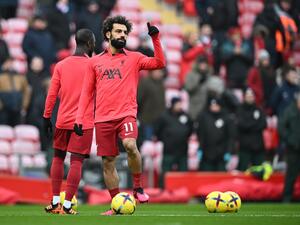 Liverpool's Egyptian striker Mohamed Salah reacts as he warms-up prior to the English Premier League football match between Liverpool and Chelsea at Anfield in Liverpool, north west England on January 21, 2023. (Photo by Paul ELLIS / AFP)