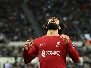 Liverpool's Egyptian striker Mohamed Salah reacts after missing to score during the English Premier League football match between Newcastle United and Liverpool at St James' Park in Newcastle-upon-Tyne, north east England on February 18, 2023. (Photo by Oli SCARFF / AFP)