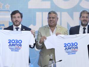 President of Conmebol Alejandro Dominguez (L), President of the Argentine Football Association Claudio "Chiqui" Tapia (C) and Argentine Tourism and Sports Minister Matias Lammens (R) pose for a picture during a press conference to launch the joint candidacy of Uruguay, Argentina, Chile and Paraguay to organize the 2030 World Cup (Photo by JUAN MABROMATA / AFP)