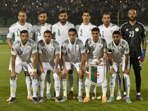 Algeria's players pose for a group picture ahead of the second leg of the 2022 Qatar World Cup African Qualifiers football match between Algeria and Cameroon at the Mustapha Tchaker Stadium in the city of Blida on March 29, 2022. (Photo by AFP)
