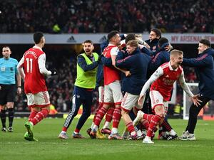 Arsenal's English midfielder Reiss Nelson (unseen) celebrates after scoring his team third goal of the team during the English Premier League football match between Arsenal and Bournemouth at the Emirates Stadium in London on March 4, 2023. (Photo by Glyn KIRK / AFP)