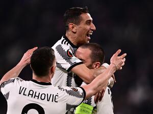 Juventus' Argentinian forward Angel Di Maria (C) celebrates with Juventus' Italian defender Leonardo Bonucci (R) and Juventus' Serbian forward Dusan Vlahovic after opening the scoring during the UEFA Europa League round of 16 first leg football match between Juventus and SC Freiburg on March 9, 2023 at the Juventus stadium in Turin. (Photo by Marco BERTORELLO / AFP)