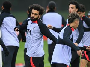 Liverpool's Egyptian striker Mohamed Salah (L) and teammates take part in a team training session at the AXA Training Centre in Liverpool, north-west England on February 20, 2023, on the eve of the UEFA Champions League round of 16 first leg football match against Real Madrid. (Photo by Lindsey Parnaby / AFP)