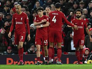 Liverpool's Egyptian striker Mohamed Salah (R) celebrates scoring the team's second goal during the English Premier League football match between Liverpool and Wolverhampton at Anfield in Liverpool, north west England on March 1, 2023. (Photo by Paul ELLIS / AFP)