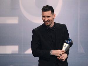 Argentina and Paris Saint-Germain forward Lionel Messi poses on stage after receiving the Best FIFA Men’s Player award during the Best FIFA Football Awards 2022 ceremony in Paris on February 27, 2023. (Photo by FRANCK FIFE / AFP)