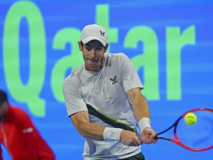 Britain's Andy Murray hits a return against Russia's Daniil Medvedev (unseen) during their Qatar Open final tennis match in Doha, on February 25, 2023. (Photo by KARIM JAAFAR / AFP)