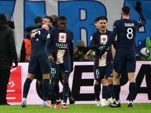 Paris Saint-Germain's players celebrate after Argentine forward Lionel Messi scored a goal during the French L1 football match between Olympique Marseille (OM) and Paris Saint-Germain (PSG) at the Velodrome stadium in Marseille, southern France on February 26, 2023. (Photo by CHRISTOPHE SIMON / AFP)